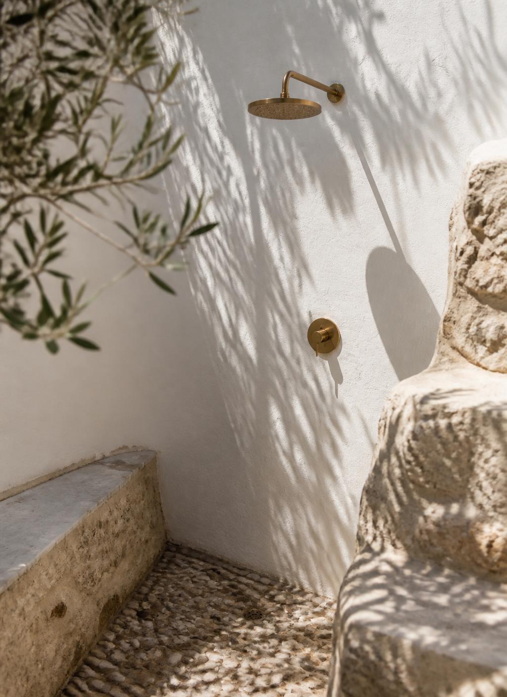 Outdoor stone shower with brass fittings