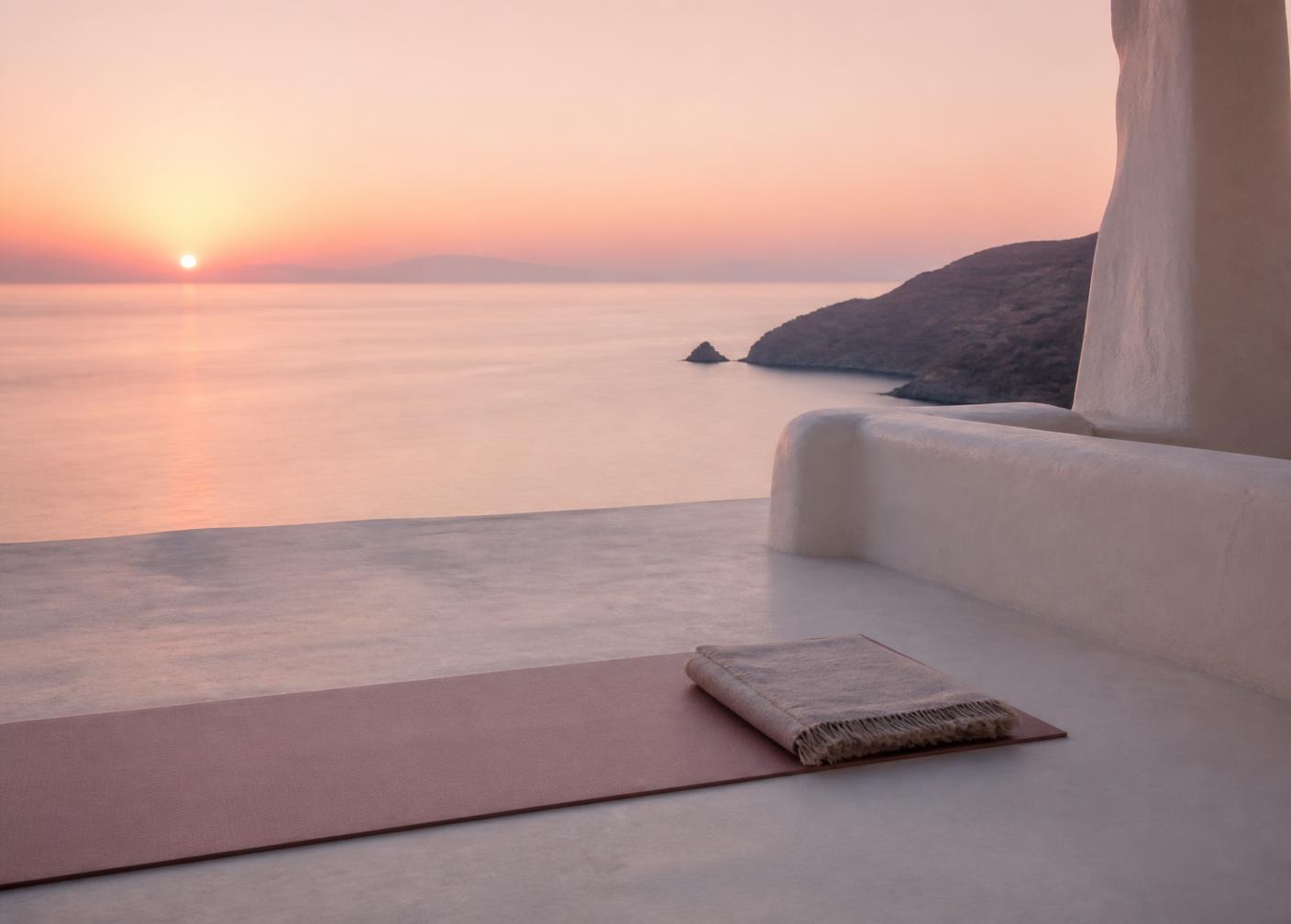 Yoga mat on a villa terrace at sunrise